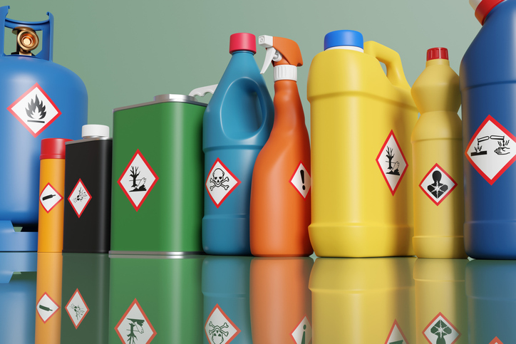 Image of containers with chemical hazard symbols