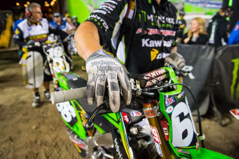 Image of a motocross racer wearing Mechanix Wear gloves.