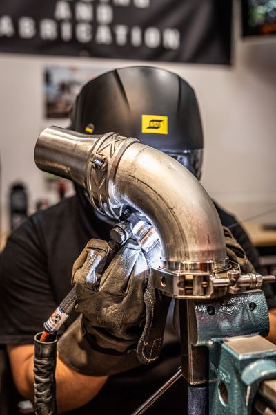 Image of a welder working while wearing a Mechanix Wear glove
