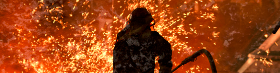 Image of a foundry worker in full protective gear